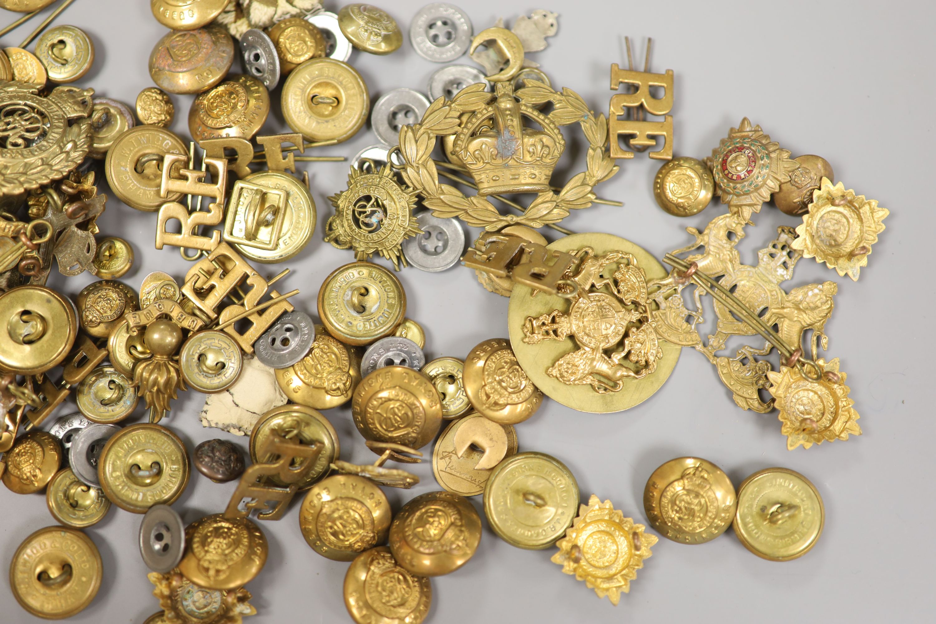 A group of Military badges and buttons